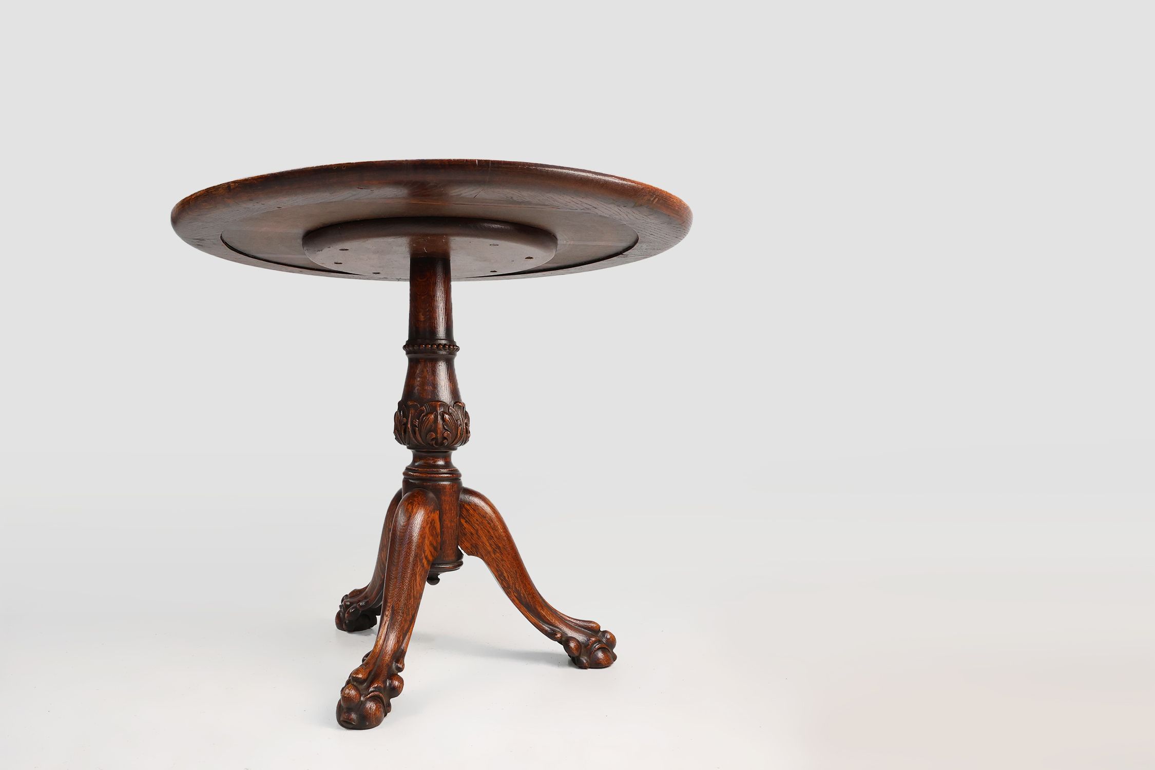 Antique English hand carved circular oak side table with lions head feet thumbnail
